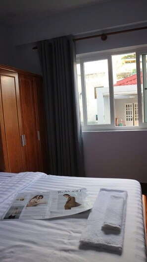 Family Double Room Single Use, Courtyard View | Iron/ironing board, free WiFi - 102 house (Ho Chi Minh City)