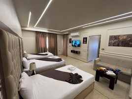 Triple Room, Garden View | Individually decorated, individually furnished, desk, laptop workspace