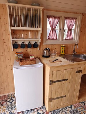 Fridge, microwave, stovetop, dining tables