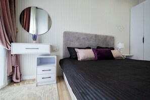 Family Condo, City View | 1 bedroom, blackout curtains, iron/ironing board, free WiFi