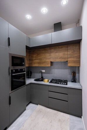 Family Condo, City View | Private kitchen | Stovetop, electric kettle