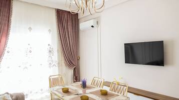 Family Condo, City View | Living area | 42-inch LCD TV with cable channels