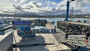 A pier with a ticket booth, a lifebuoy, and a lighthouse. - Luxury 3 bedroom villa overlooking golf course with private pool and Wi-fi (Caleta De Fuste)