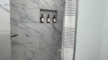 Shower, towels, soap, toilet paper