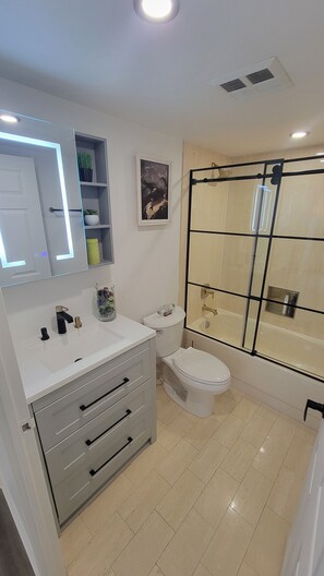 Shower, hair dryer, towels, soap