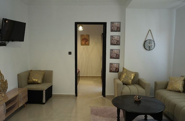 Family Apartment, City View | Living area | Flat-screen TV - Coqueto apartment ghiliz (Marrakech)