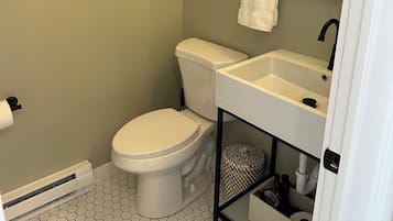 Shower, hair dryer, towels, toilet paper