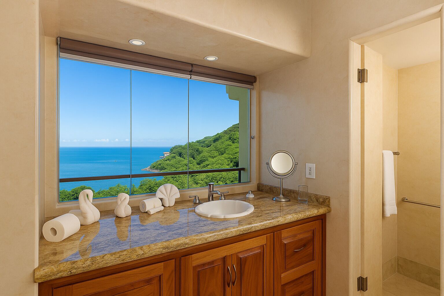 A bathroom with a large window offering a view of the ocean and greenery.