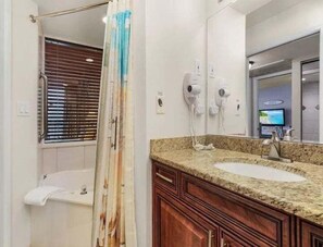 Shower, jetted tub, hair dryer, towels - Perfect Island Escape - Beach, Pool, Restaurant & More! -FMB Condo Island Paradise - Roelens (Fort Myers Beach)
