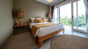 A bedroom with a bed, bedside tables, a large window, and a view of greenery. - Seminyak 3BR Private Pool Villa (Seminyak)