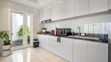 Fridge, microwave, stovetop, coffee/tea maker