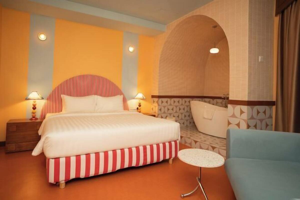 Desk, laptop workspace, blackout drapes, iron/ironing board