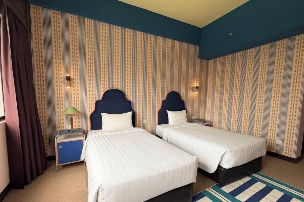 Desk, laptop workspace, blackout drapes, iron/ironing board