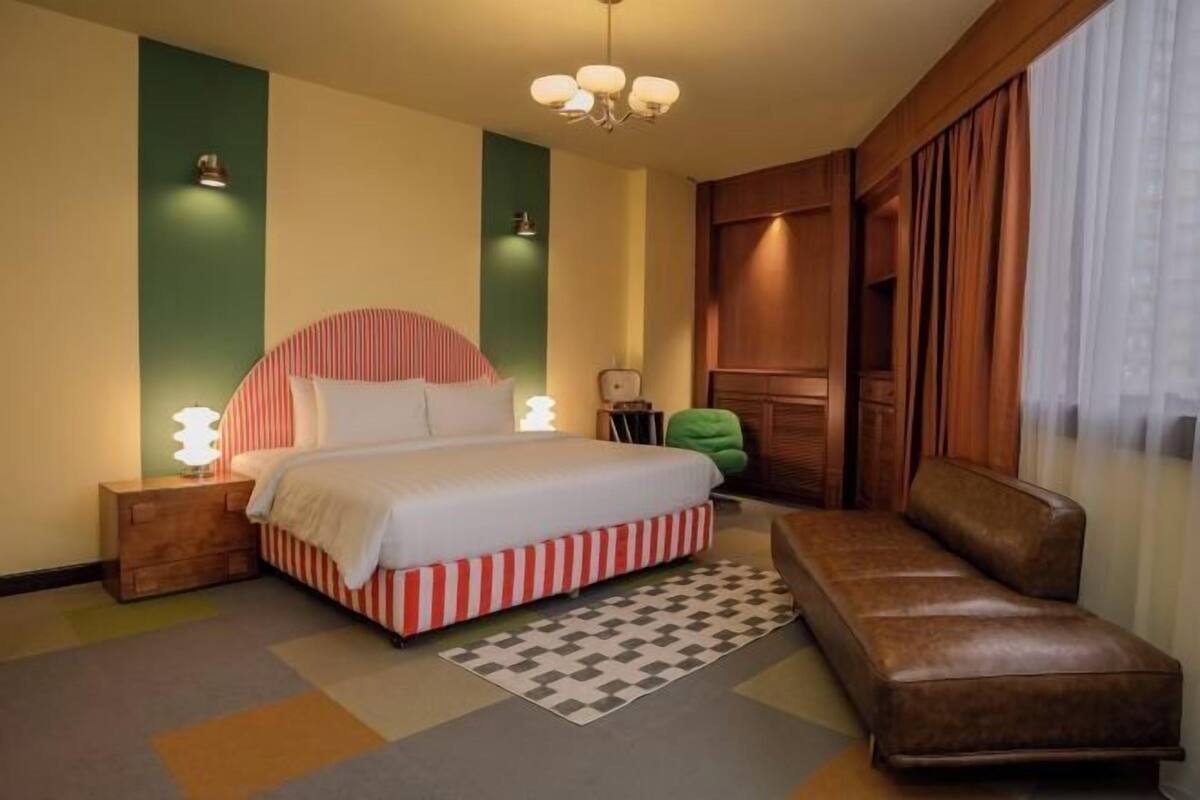 Desk, laptop workspace, blackout drapes, iron/ironing board