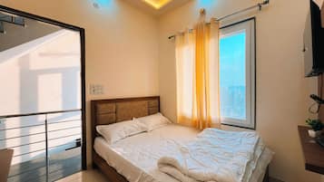 Deluxe Double Room, Balcony, City View | Desk, laptop workspace, free WiFi