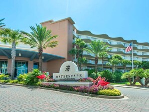 A hotel entrance with a sign reading "WATERSCAPE" and "1100 Santa Rosa Blvd."