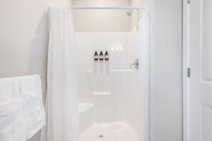 Hair dryer, towels, shampoo, toilet paper