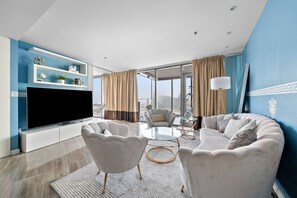 TV - Cozy Waterfront Stay with Balcony, Kitchen & Smart TV (Al Jaddaf)