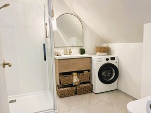 Shower, hair dryer, towels, soap