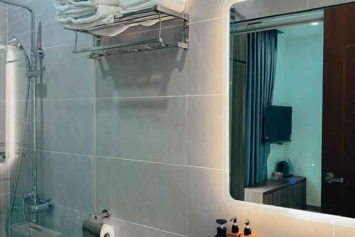 Bathroom | Shower, hair dryer, slippers, towels