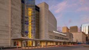 The Oklahoma City Museum of Art with a modern architectural design, featuring a prominent glass facade and a curved structure. - Spacious Retreat 8 Bedroom River (Bethany)