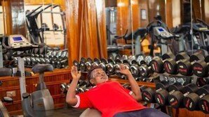 A gym with exercise equipment, including treadmills and dumbbells. - Tick Hotel (Kampala)