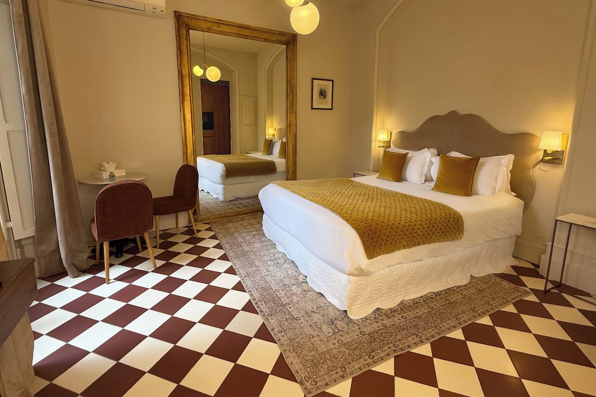 Double Room, Garden View | 1 bedroom, in-room safe, blackout curtains, iron/ironing board