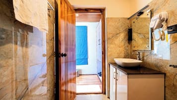 Shower, towels, soap, toilet paper