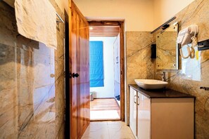 Shower, towels, soap, toilet paper