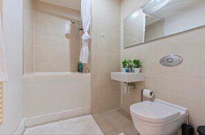 Apartment | Bathroom | Separate tub and shower, deep soaking tub, towels, toilet paper