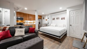 A compact living space with a kitchenette, a bed, a sofa, and a dining area. - Stunning Deluxe King Studio  #124 at Donner Lake Village (Truckee)