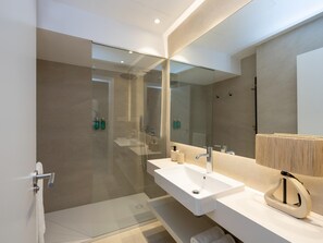 Shower, hair dryer, towels, toilet paper