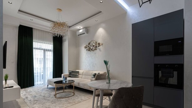 A modern living room with a sofa, coffee table, and dining area. There is a kitchen with a microwave and oven. - Tashkent city Bulevard Fontaine (Tashkent)