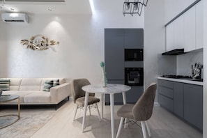 Family Condo, Balcony, City View | Living area