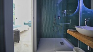 A modern bathroom with a glass shower enclosure, a wooden vanity, and a large mirror. - Becoloured Water Lily Suite. Where it is possible to dream among the masterpieces of art. (Napoli)