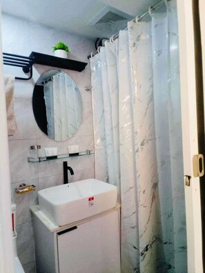 Bidet, towels, soap, toilet paper