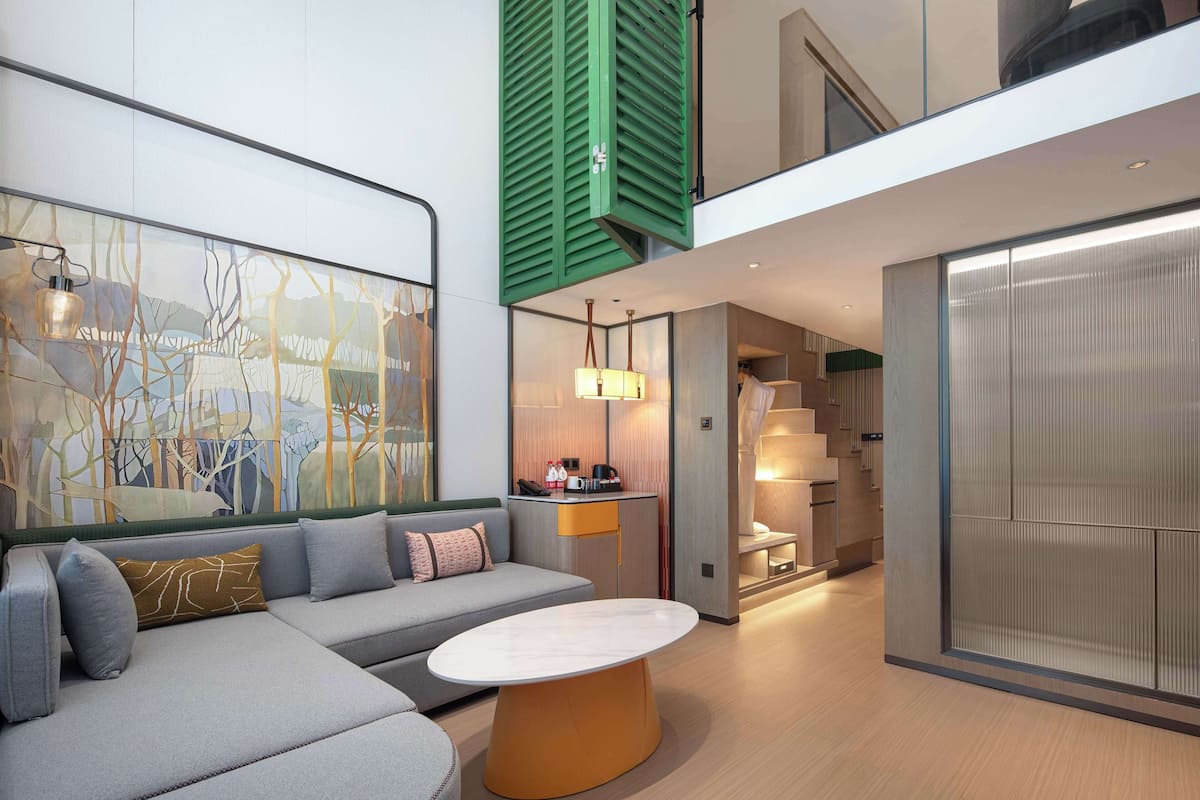 Suite, 1 Queen Bed (Duplex) | Living area | TV, printers