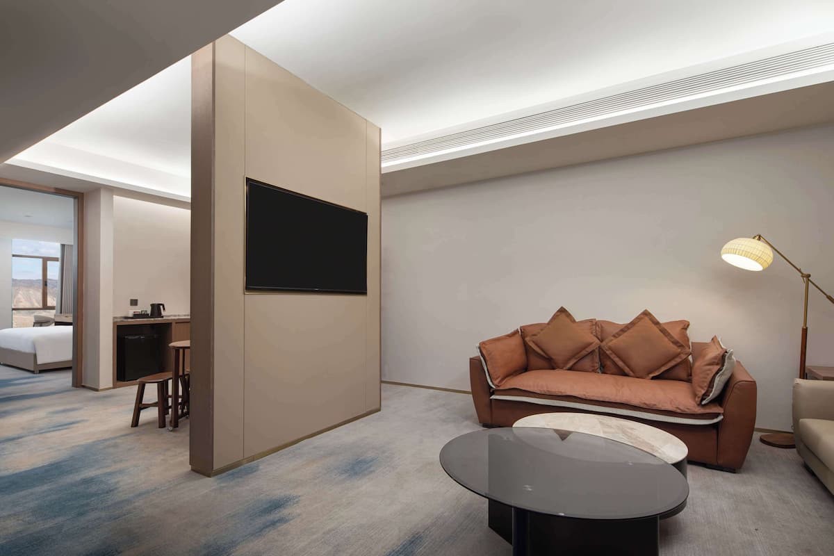 Deluxe Suite, 1 King Bed | Living area | TV, printers