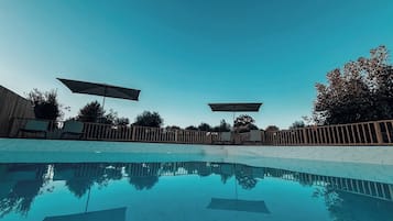 Outdoor pool, pool umbrellas, sun loungers