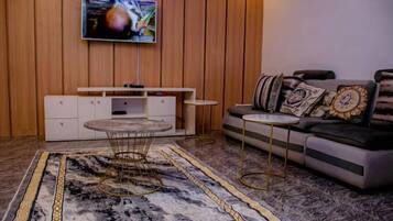 Luxury Apartment, Balcony, City View | Living area | Flat-screen TV