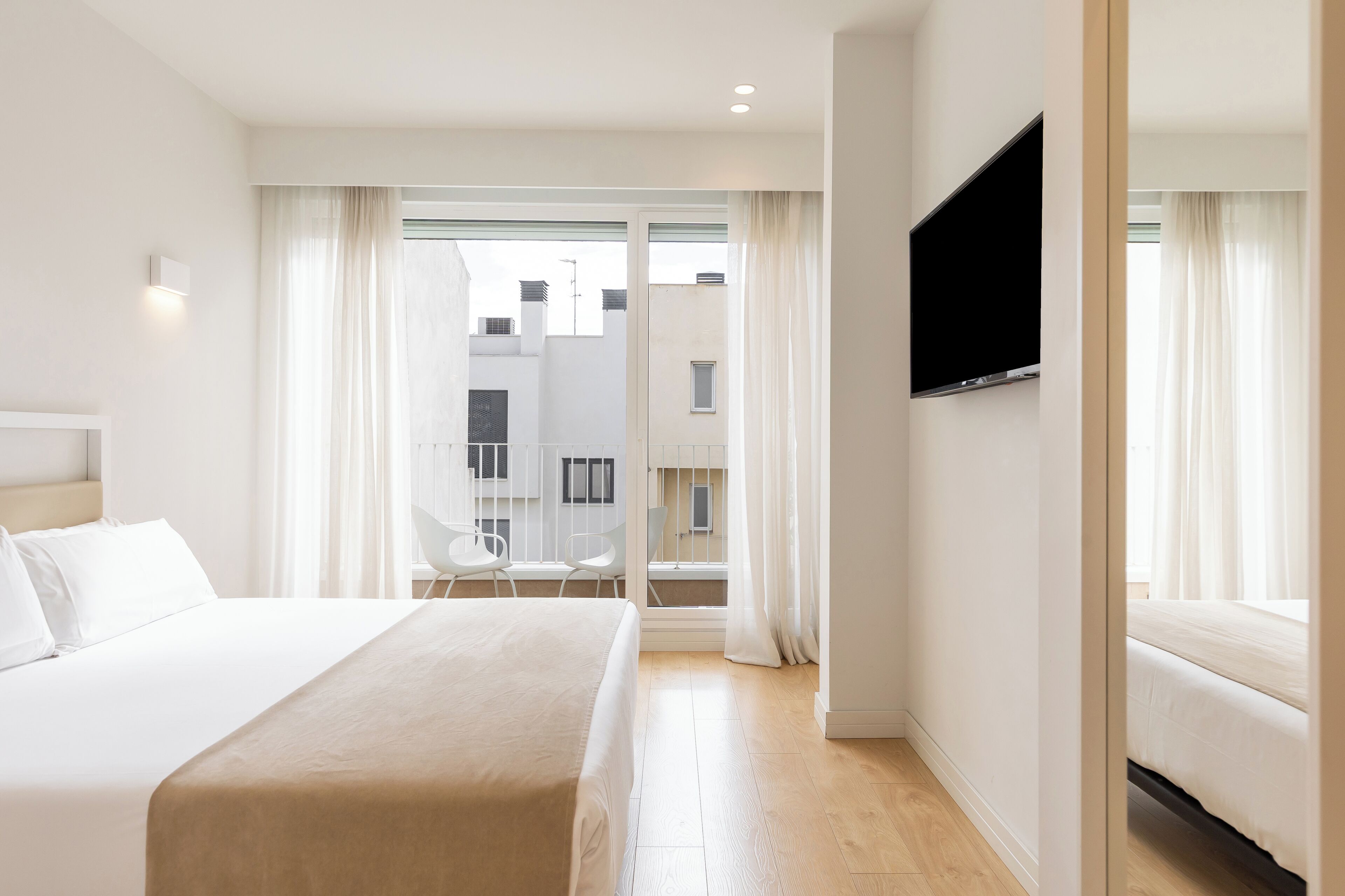 Deluxe Apartment, City View | In-room safe, desk, laptop workspace, iron/ironing board