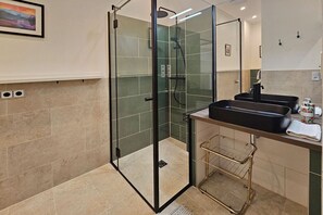 Apartment, City View | Bathroom | Shower, rainfall showerhead, hair dryer, towels