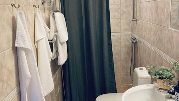 Garden Room, Breakfast Included | Bathroom | Shower, hair dryer, towels, soap