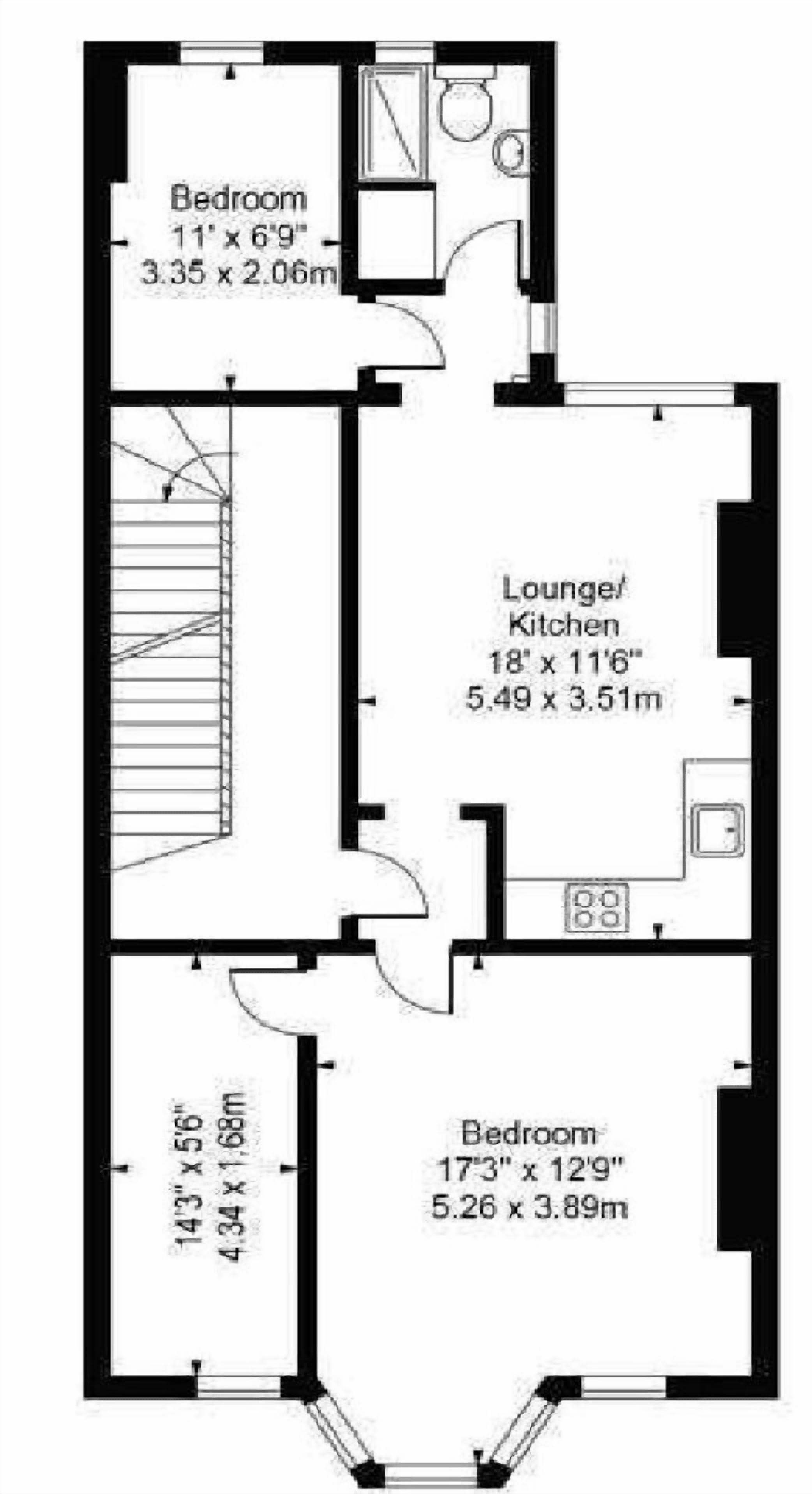 Een plattegrond met twee slaapkamers, een woon-/keuken en een badkamer.