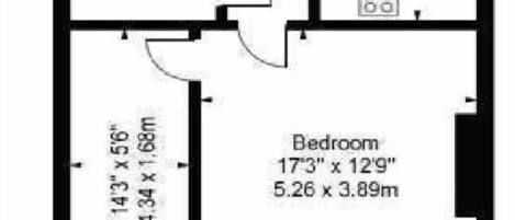 Een plattegrond met twee slaapkamers, een woon-/keuken en een badkamer.