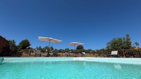 Outdoor pool, pool umbrellas, sun loungers