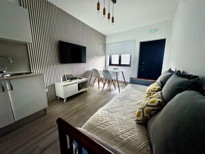 Comfort Cottage, Mountain View | Living area | 90-inch flat-screen TV with cable channels