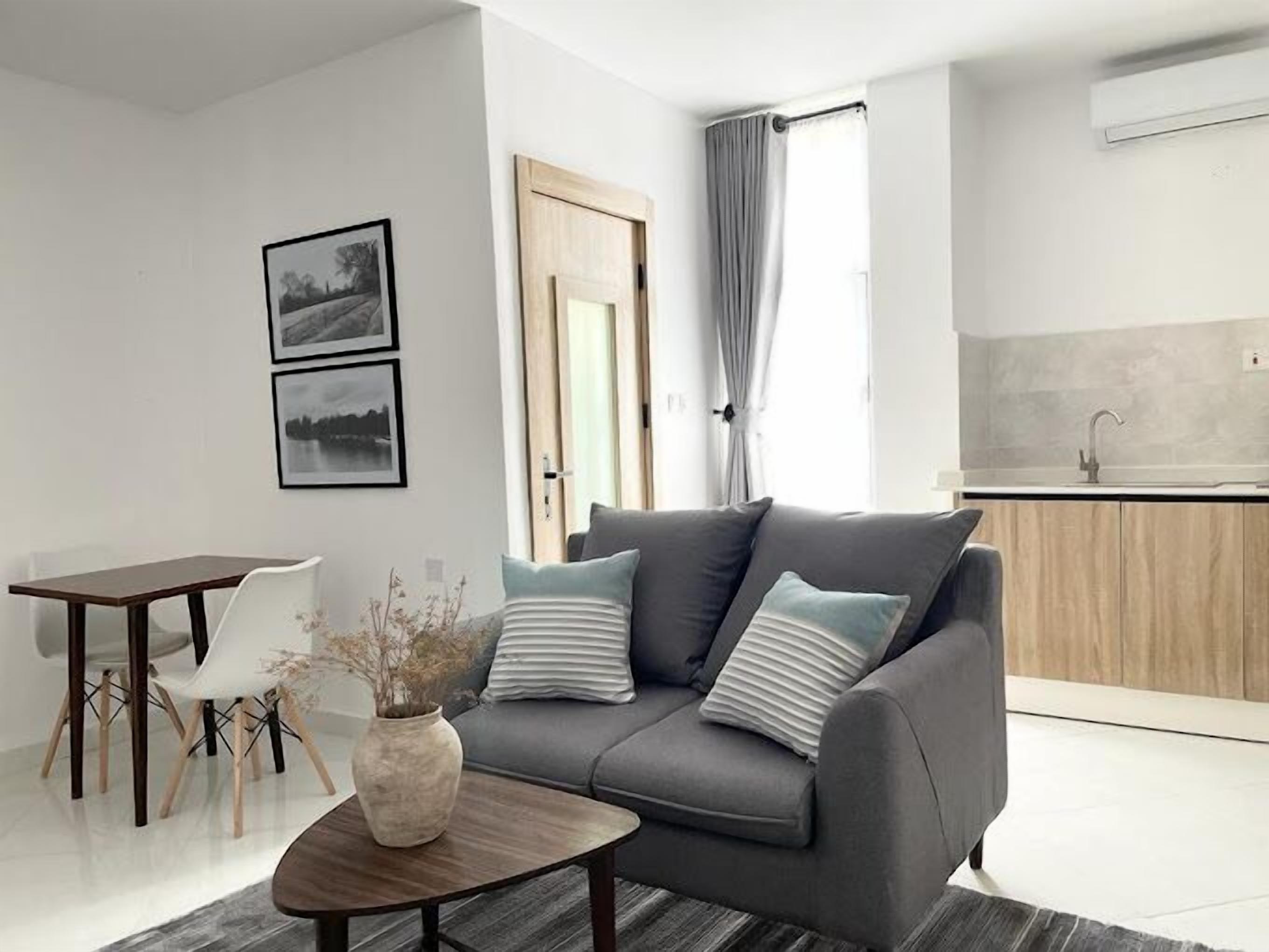 Junior Apartment, Balcony, City View | Living area | Flat-screen TV