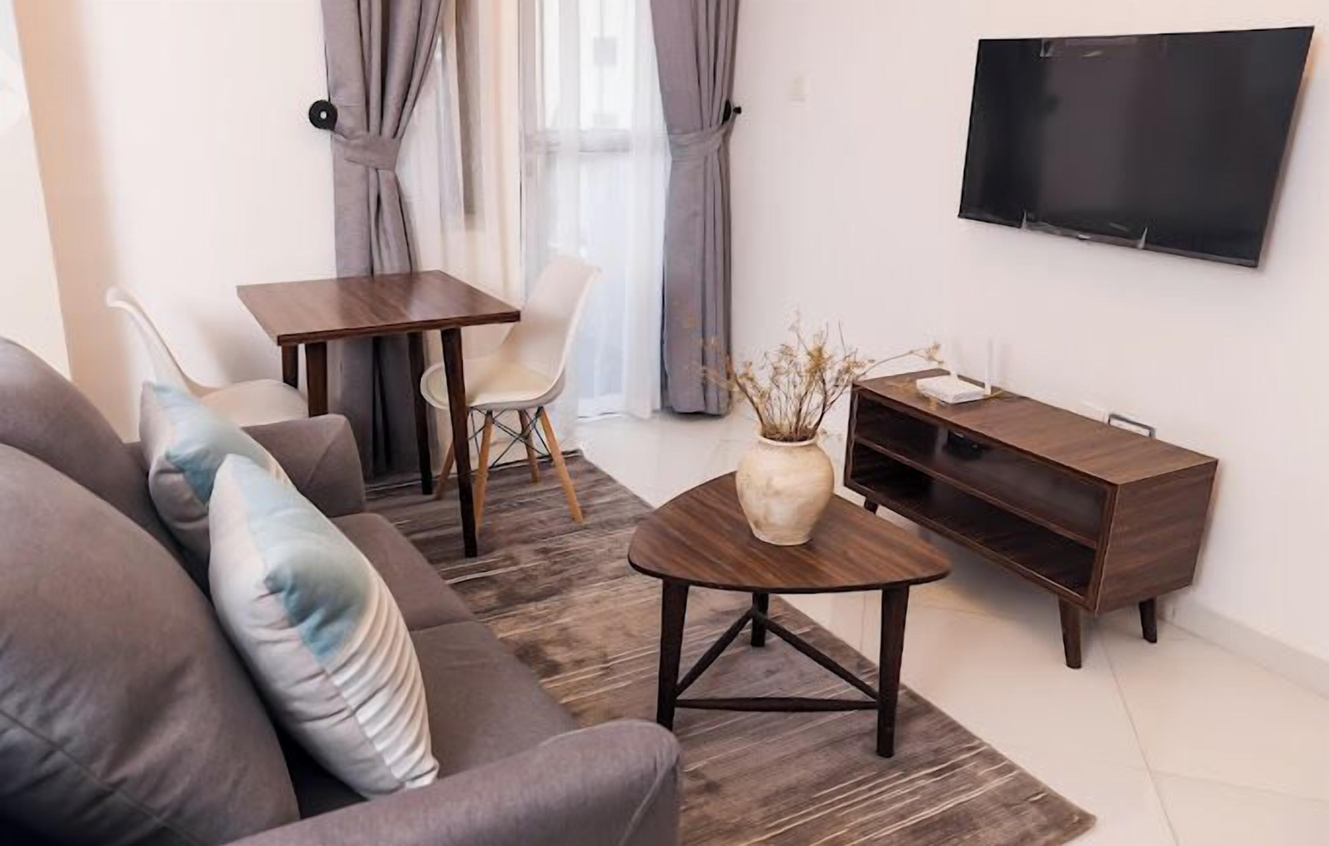 Junior Apartment, Balcony, City View | Living area | Flat-screen TV
