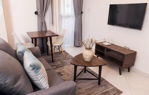 Junior Apartment, Balcony, City View | Living area | Flat-screen TV - Sigmabase Apartments (Lagos)
